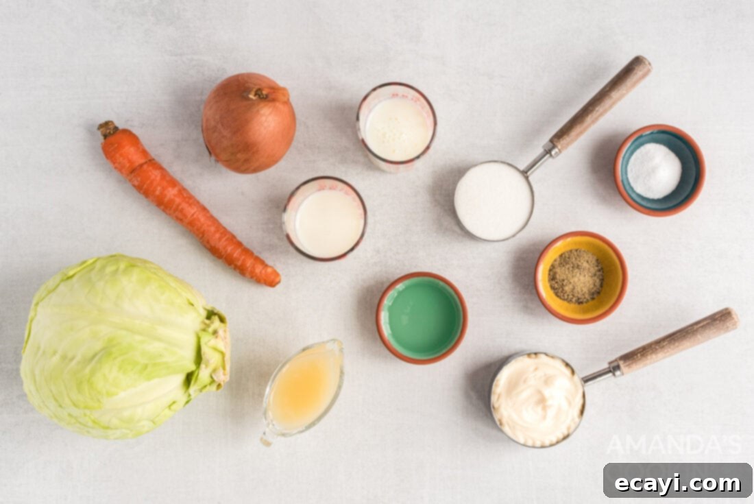The Ultimate KFC Coleslaw Recipe 2 An array of fresh ingredients including cabbage, carrots, onion, mayonnaise, milk, buttermilk, sugar, lemon juice, vinegar, salt, and pepper laid out for making KFC coleslaw.
