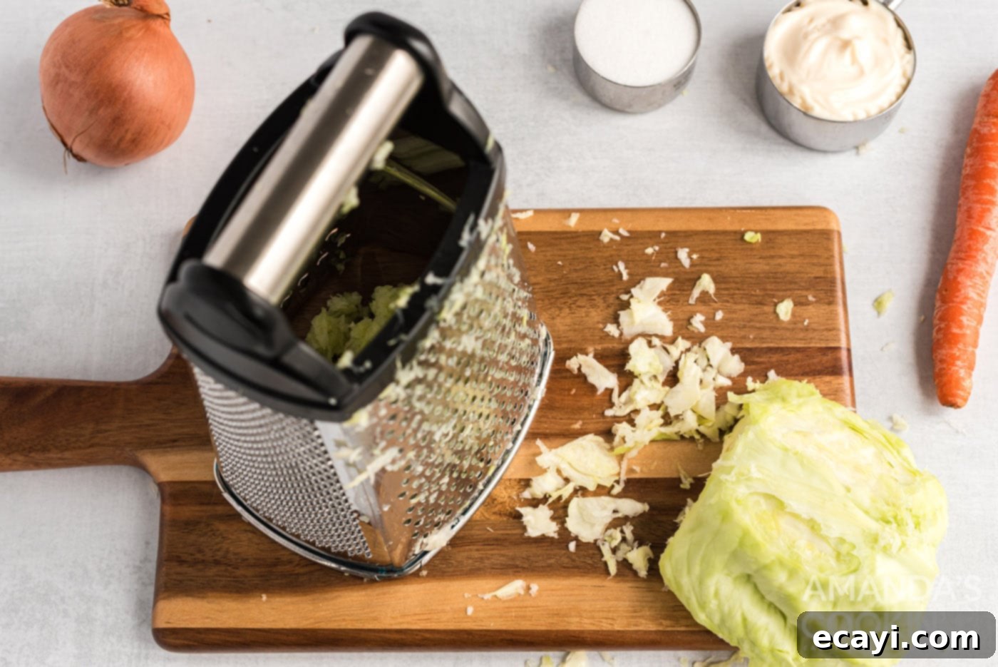 The Ultimate KFC Coleslaw Recipe 3 Finely grating cabbage in a food processor for homemade KFC coleslaw.