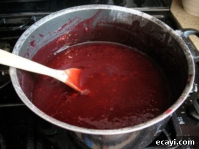 The Best Homemade Cherry Pie Filling 15 Cherry pie filling mixture heating in a pot