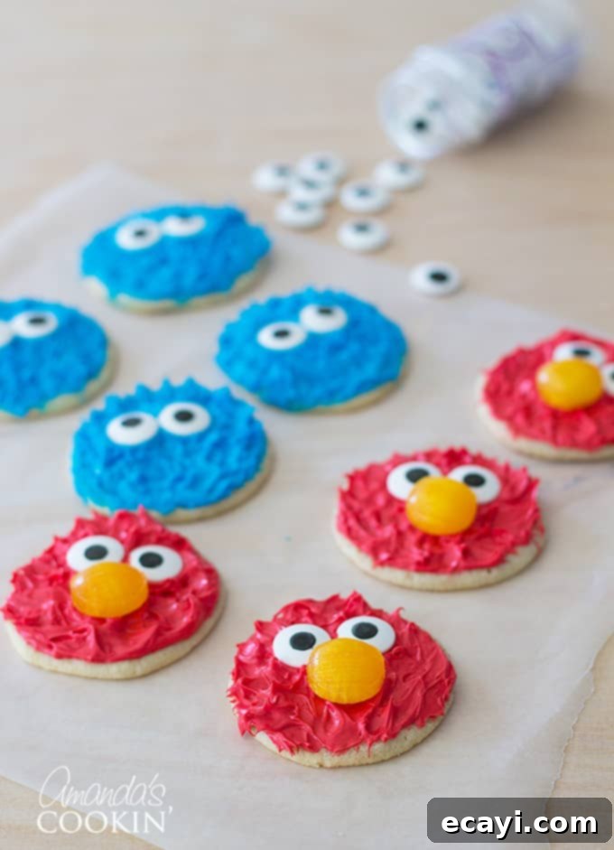 Spiderman Cake Magic: Homemade Marshmallow Fondant 10 Close-up of vibrant and fun Cookie Monster and Elmo Cookies, great for kids' parties.