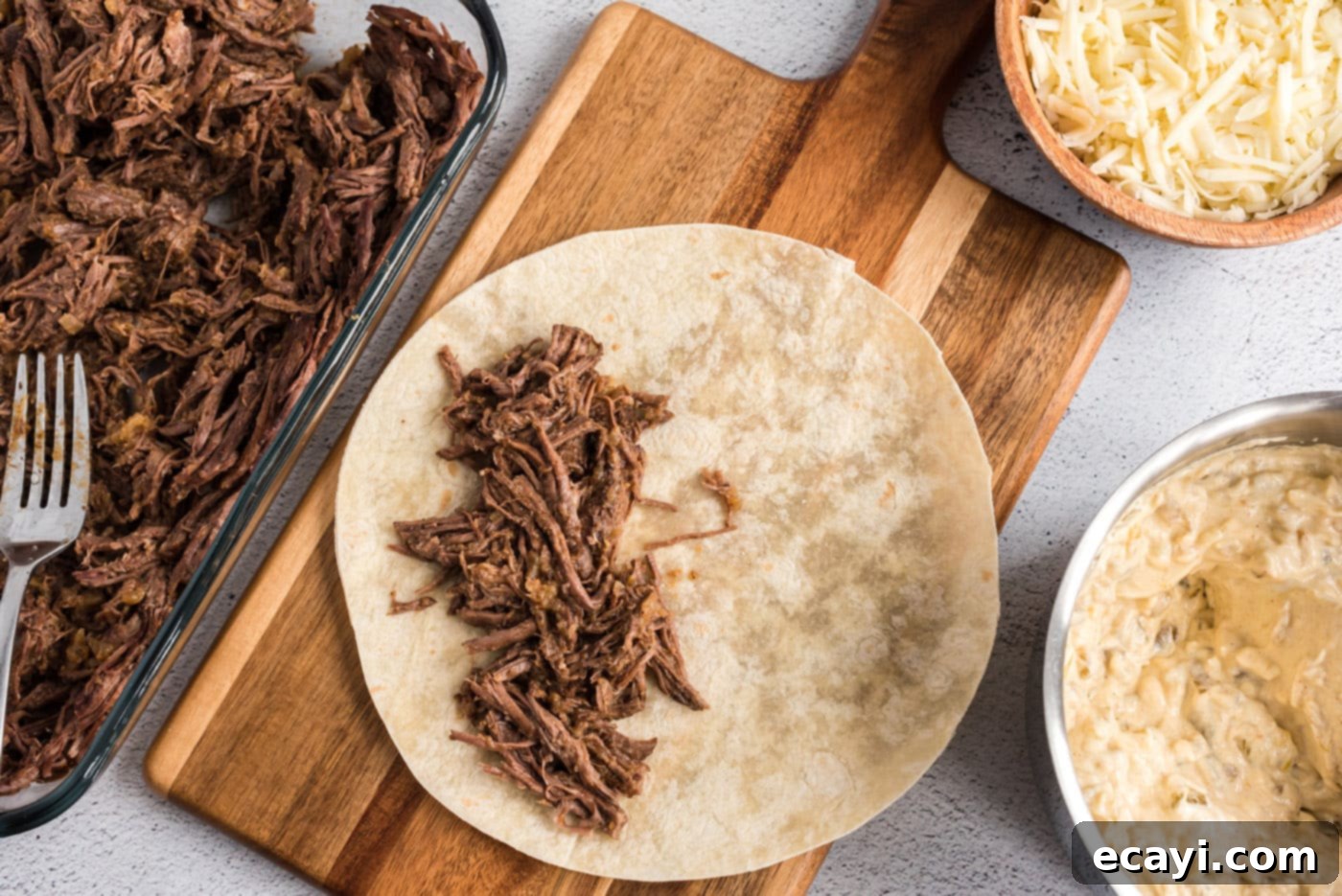 Classic Smothered Beef Enchiladas 15 Shredded beef filling on a flour tortilla