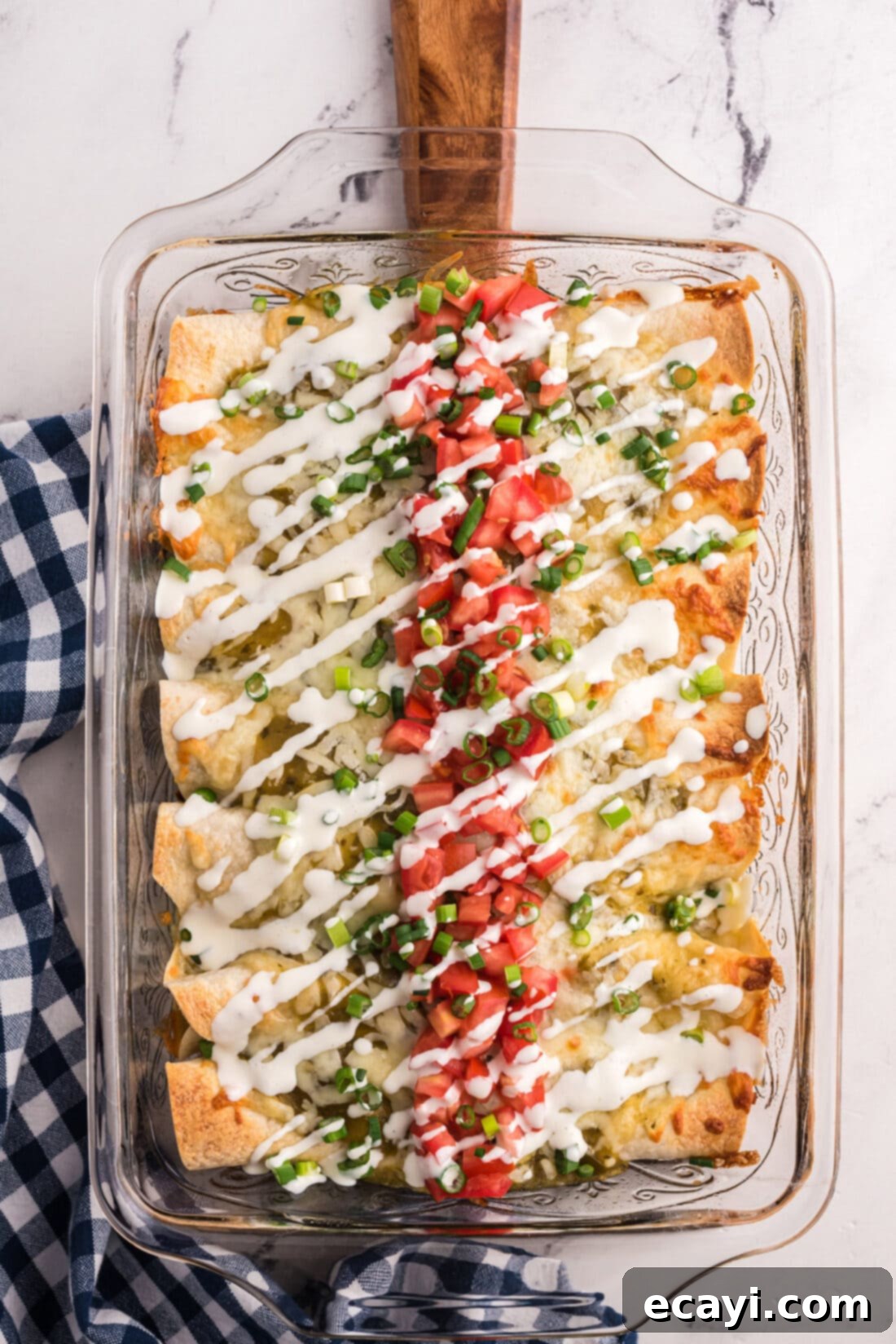 Classic Smothered Beef Enchiladas 3 Overhead view of a pan of Shredded Beef Enchiladas, golden brown and cheesy
