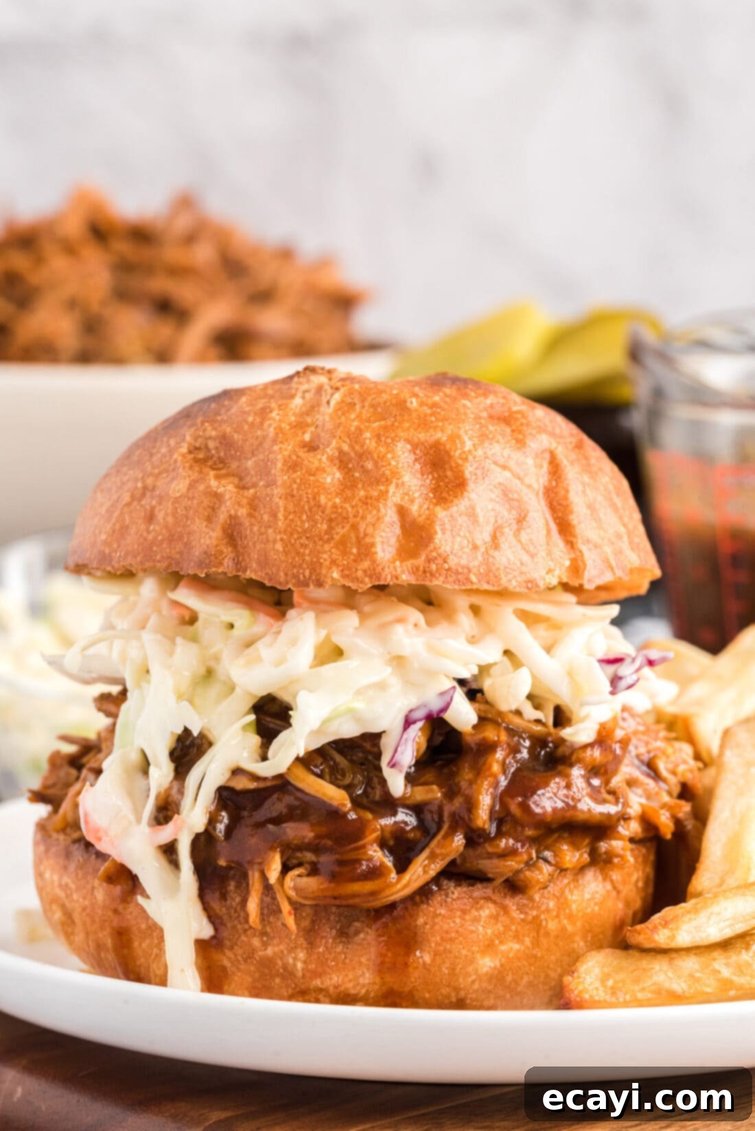 Fall-Apart Tender Slow Cooker Pulled Pork 2 Slow Cooker Pulled Pork sandwich with coleslaw