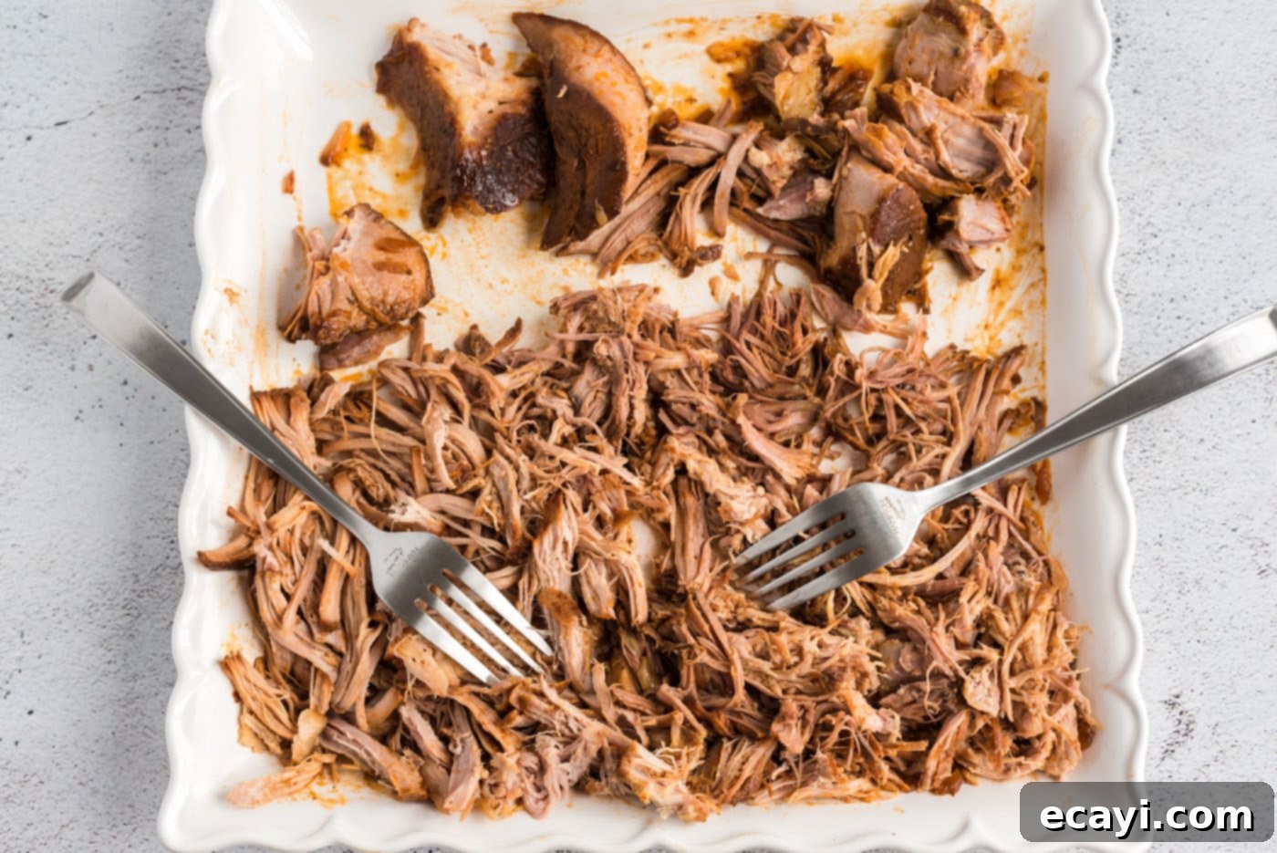 Fall-Apart Tender Slow Cooker Pulled Pork 8 forks shredding pulled pork