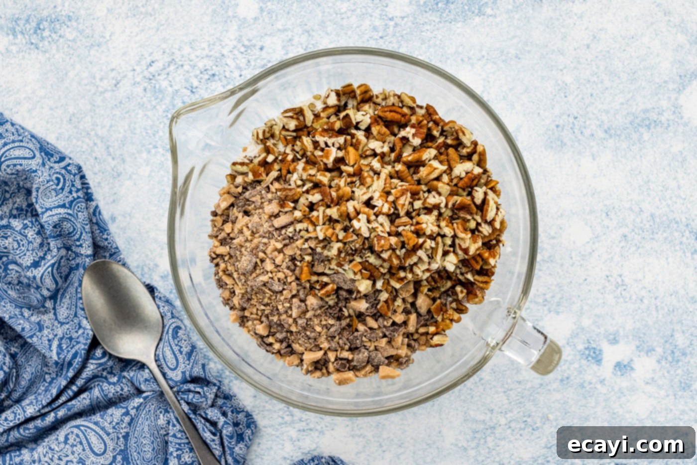 Golden Brown Butter Toffee Bars 6 pecans and toffee bits in a bowl