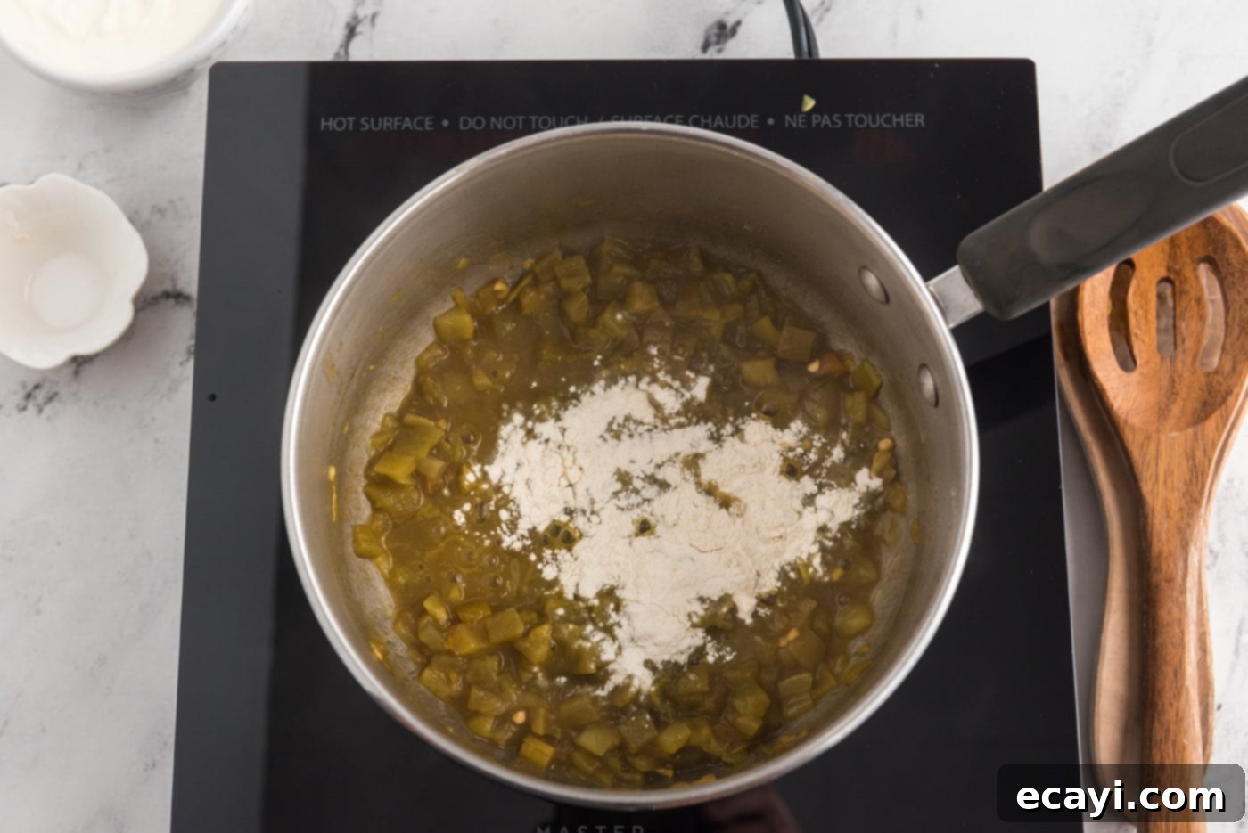 Zesty Chicken Chile Enchiladas 11 Green chiles cooking in a saucepan, warming up for the sauce.