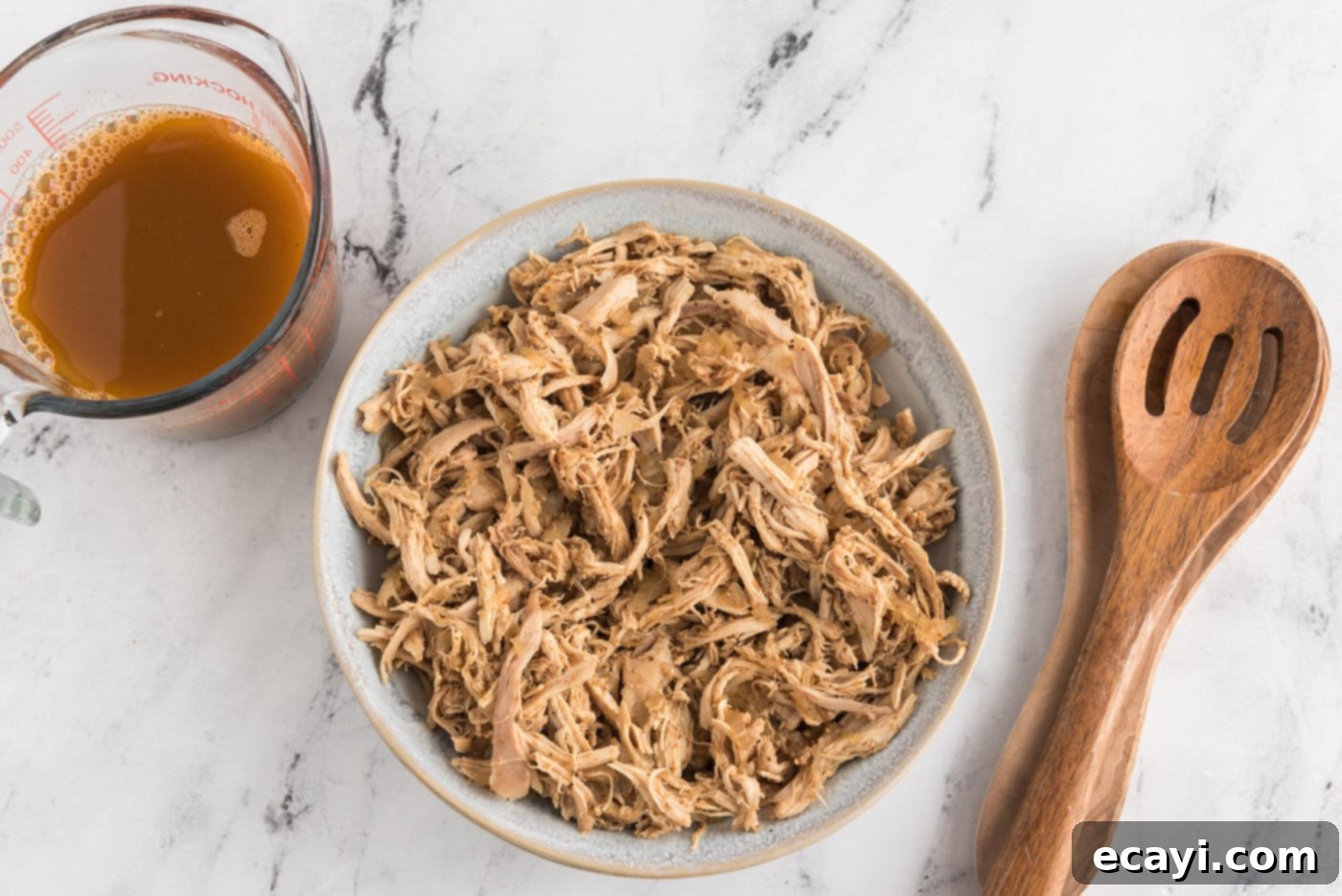 Zesty Chicken Chile Enchiladas 9 A bowl of seasoned shredded chicken mixture, perfectly prepared for enchilada filling.