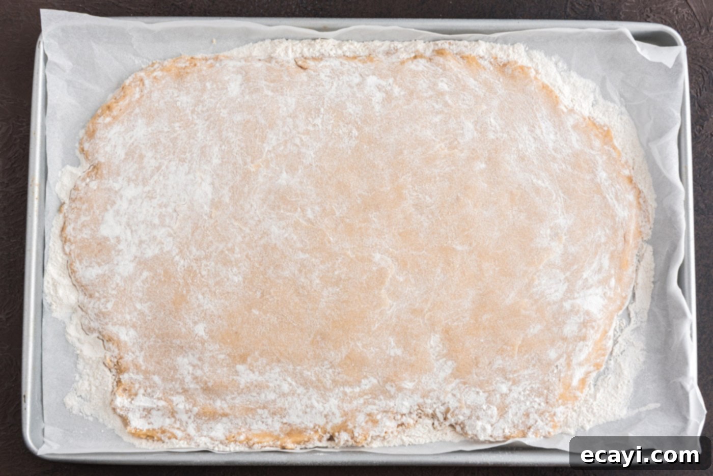 Apple Cider Doughnuts 17 flattened donut dough on a baking sheet, ready for chilling in the freezer