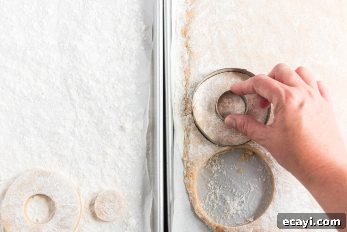 Apple Cider Doughnuts 18 cutting out donut shapes with a biscuit cutter on floured dough