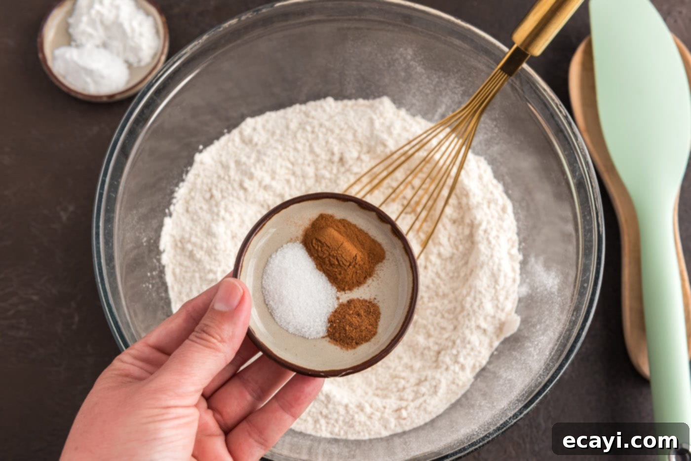 Apple Cider Doughnuts 5 adding spices to flour in a bowl