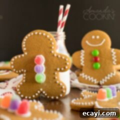 Festive Gingerbread Delights 4 A delicious gingerbread man cookie stands next to a refreshing glass of milk, a classic holiday treat.
