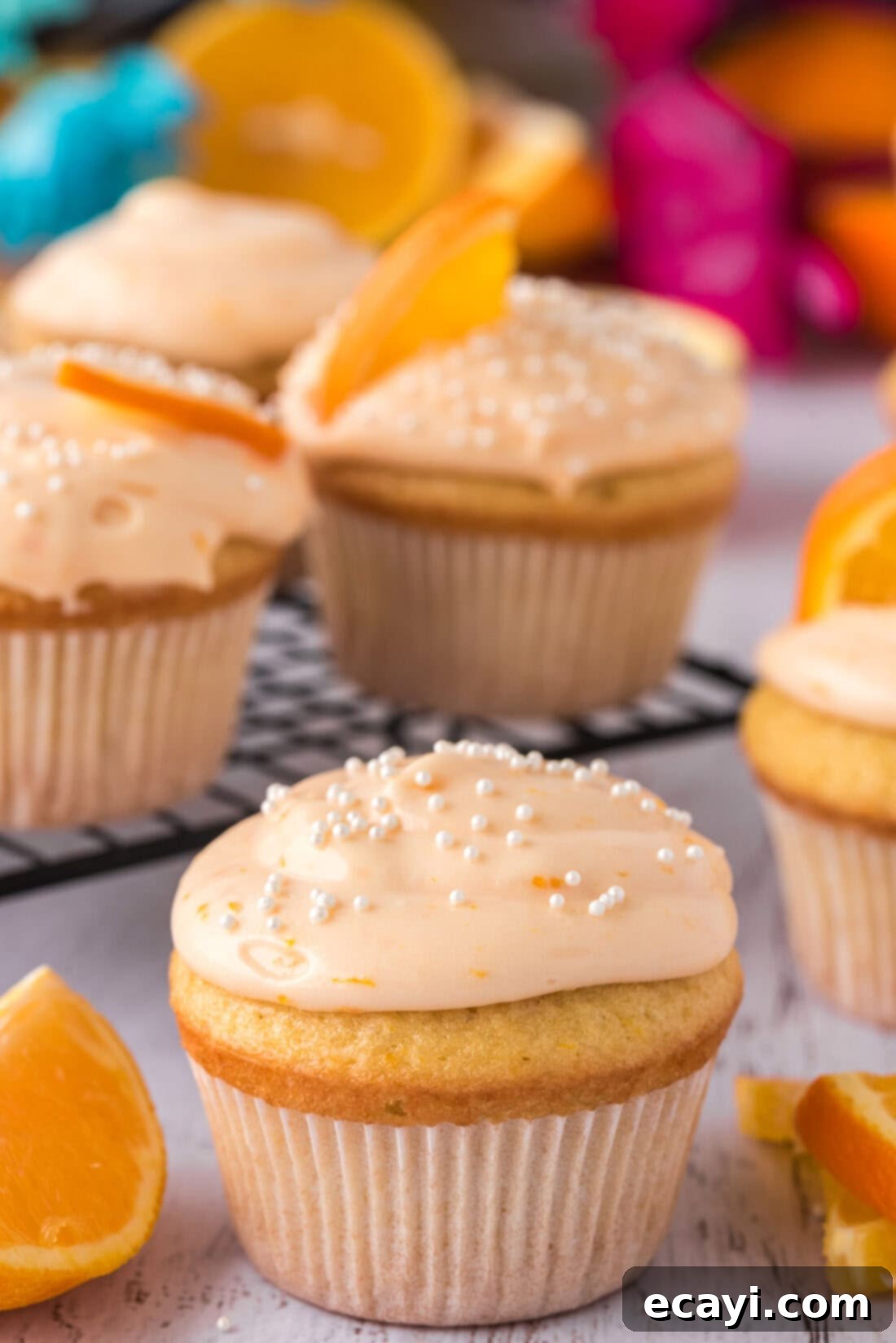 Orange Dream Swirl Cupcakes 3 A cluster of beautifully frosted Orange Creamsicle Cupcakes, ready for serving.