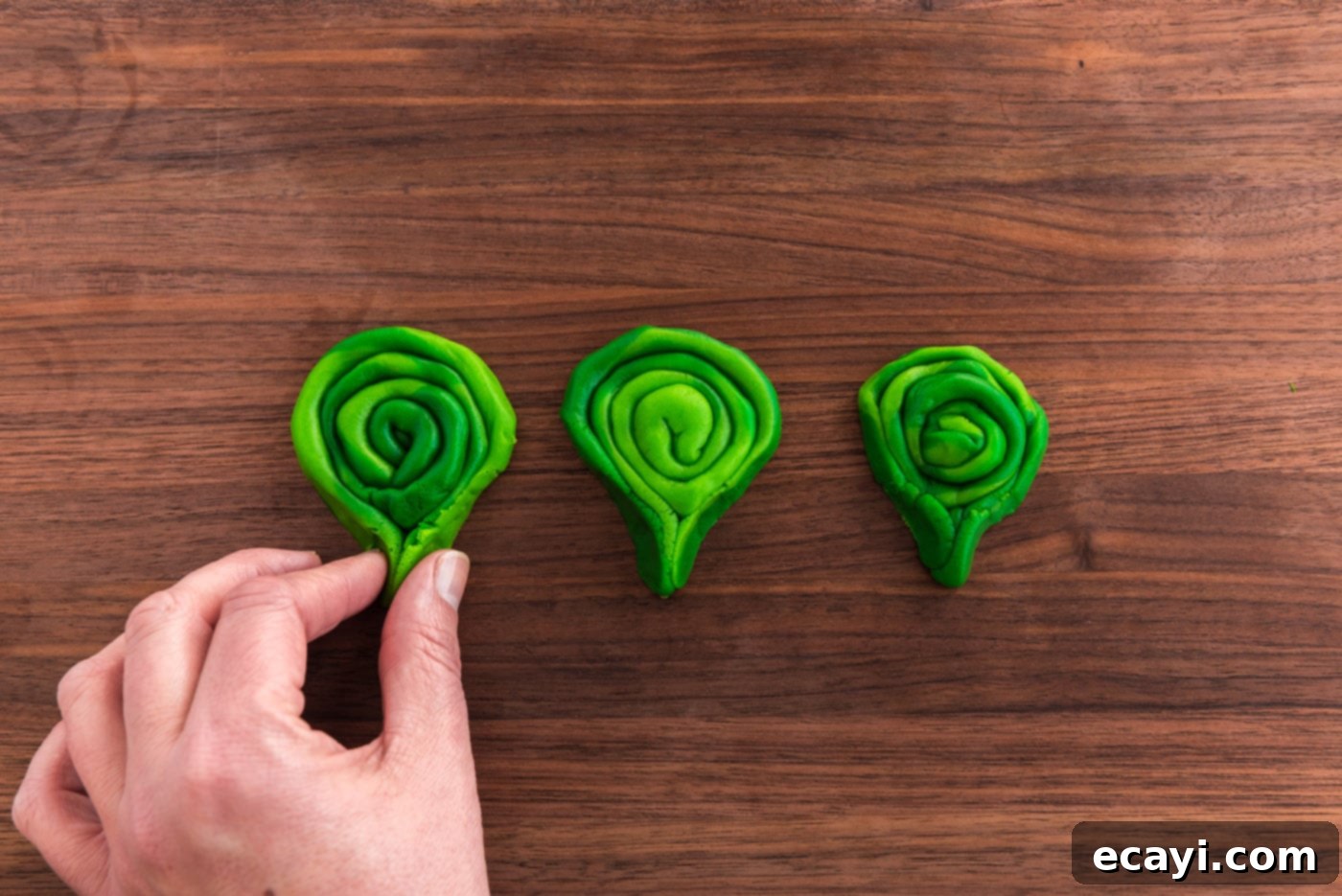 Green St Patricks Day Cookies 12 pinching ends of coiled green cookie dough