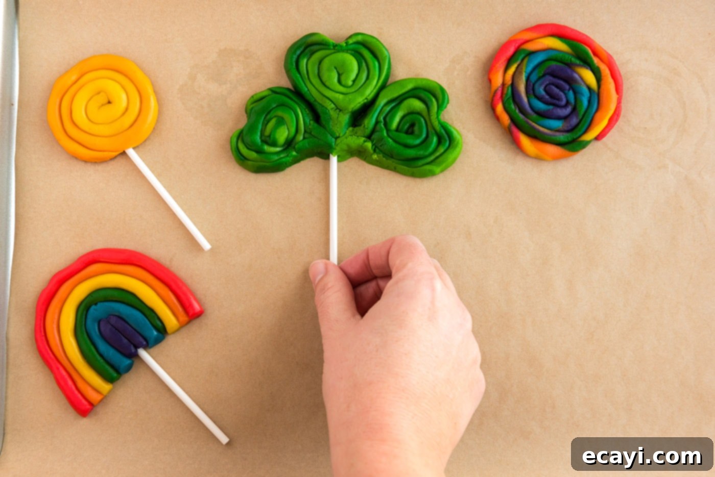 Green St Patricks Day Cookies 13 adding lollipop sticks to shamrock cookies