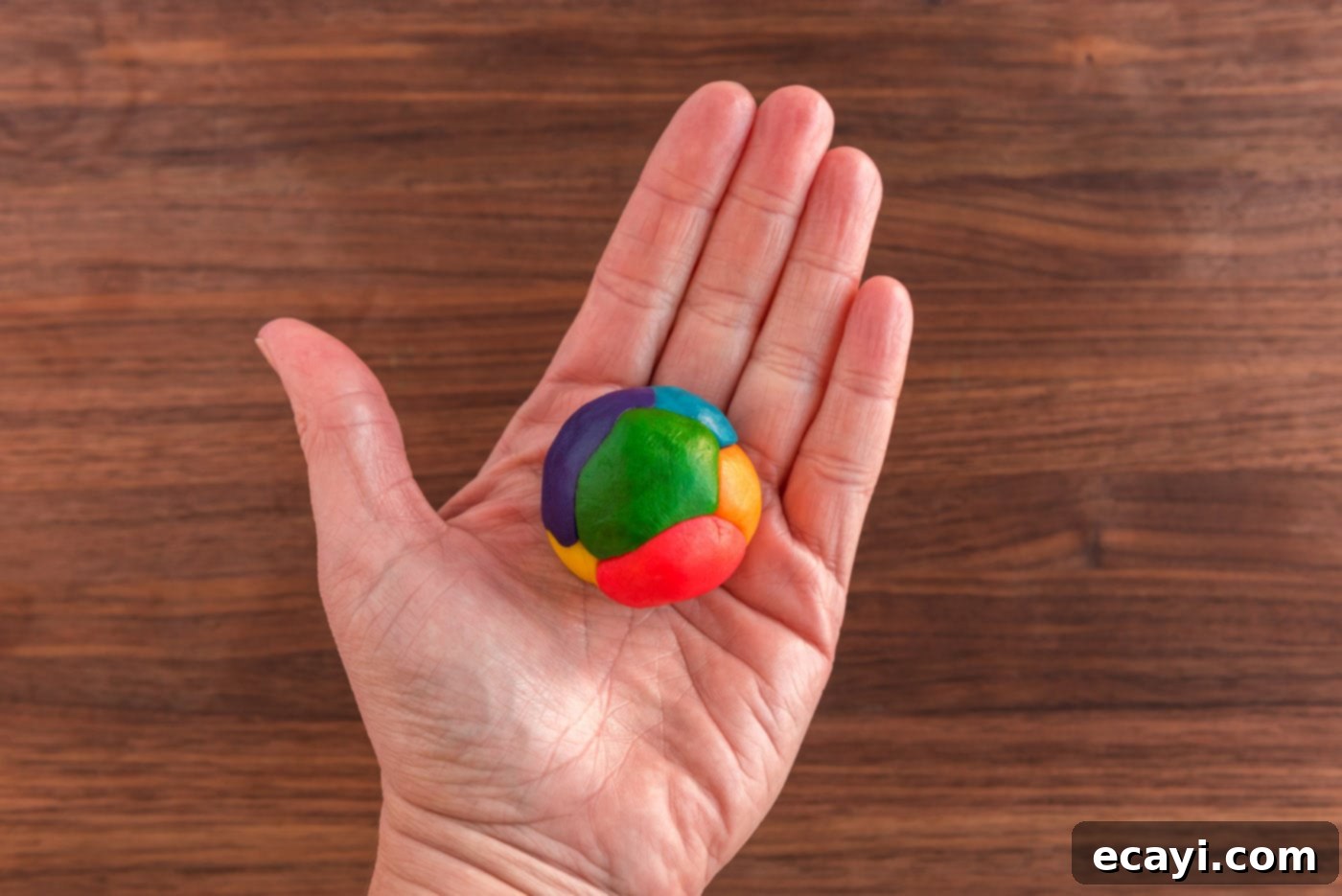 Green St Patricks Day Cookies 16 hand holding a ball of colorful cookie dough