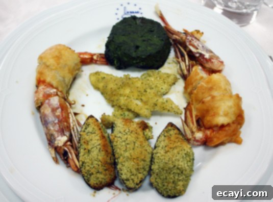 Giant prawns, white fish fillets, mussels and a spinach and ricotta flan Giant prawns, white fish fillets, mussels and a spinach and ricotta flan