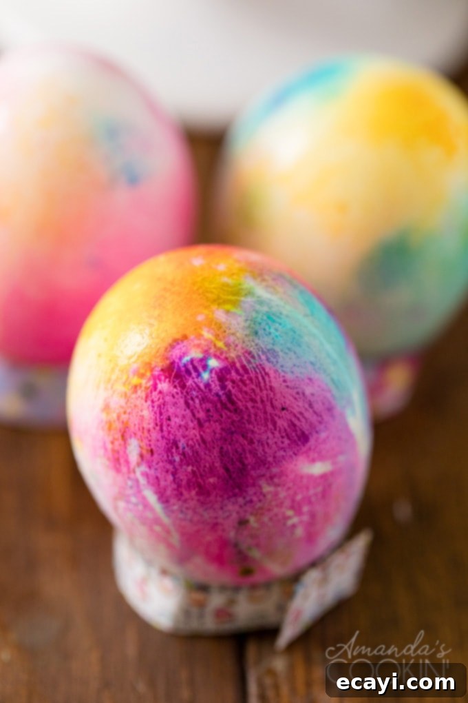Admire your vibrant, handcrafted tie-dye Easter eggs! A beautifully completed tie-dye Easter egg with vibrant, swirled colors
