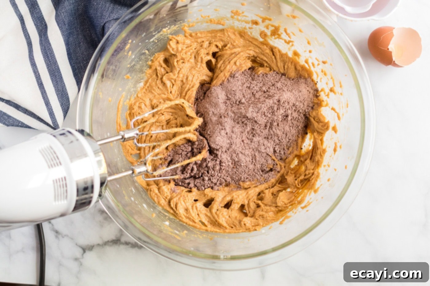 The Ultimate Chocolate Peanut Butter Cookies 6 The dry ingredient mixture (flour, cocoa, salt, baking soda) being slowly added to the wet creamed mixture.