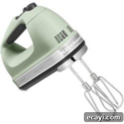 Delicious Gifts for Food Lovers 2 A close up of a sleek, modern hand mixer in a kitchen setting