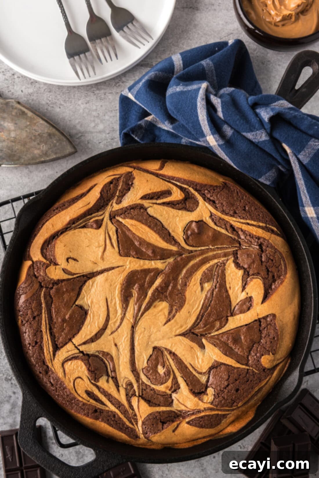 Deep Dish Peanut Butter Brownie 2 Peanut Butter Marbled Brownie Skillet Pie with plates in the background