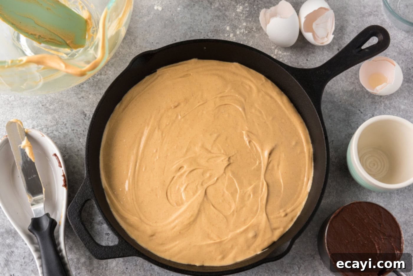 Deep Dish Peanut Butter Brownie 12 peanut butter cream cheese mixture added on top of brownie batter in a skillet