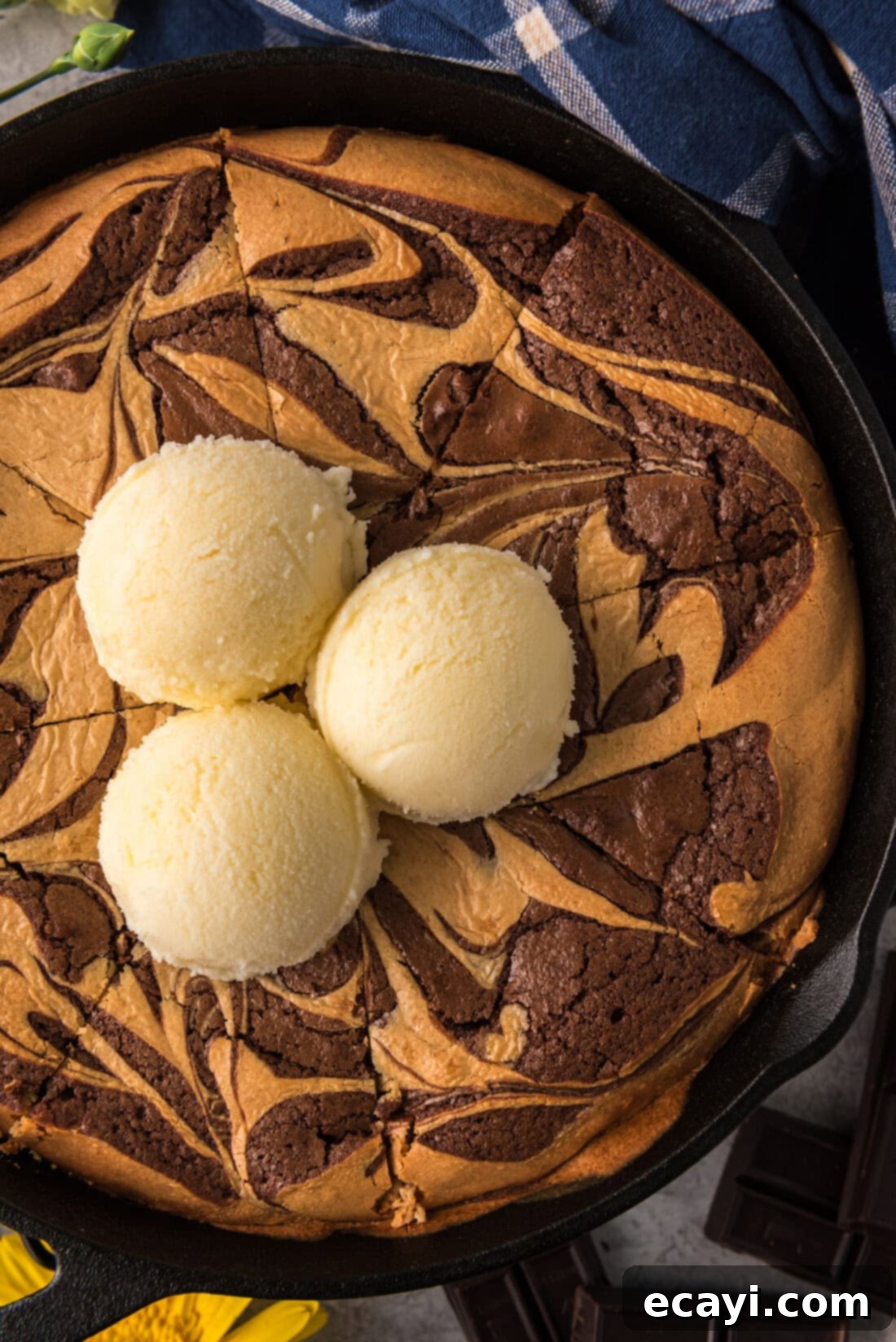 Deep Dish Peanut Butter Brownie 15 Close up photo of a Peanut Butter Marbled Brownie Skillet Pie topped with three scoops of ice cream