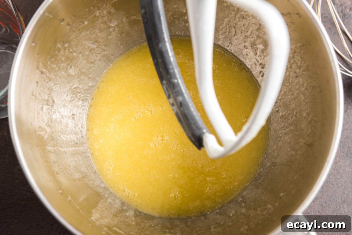 Decadent Chocolate Fudge Delight 11 combining melted butter and canola oil in a bowl