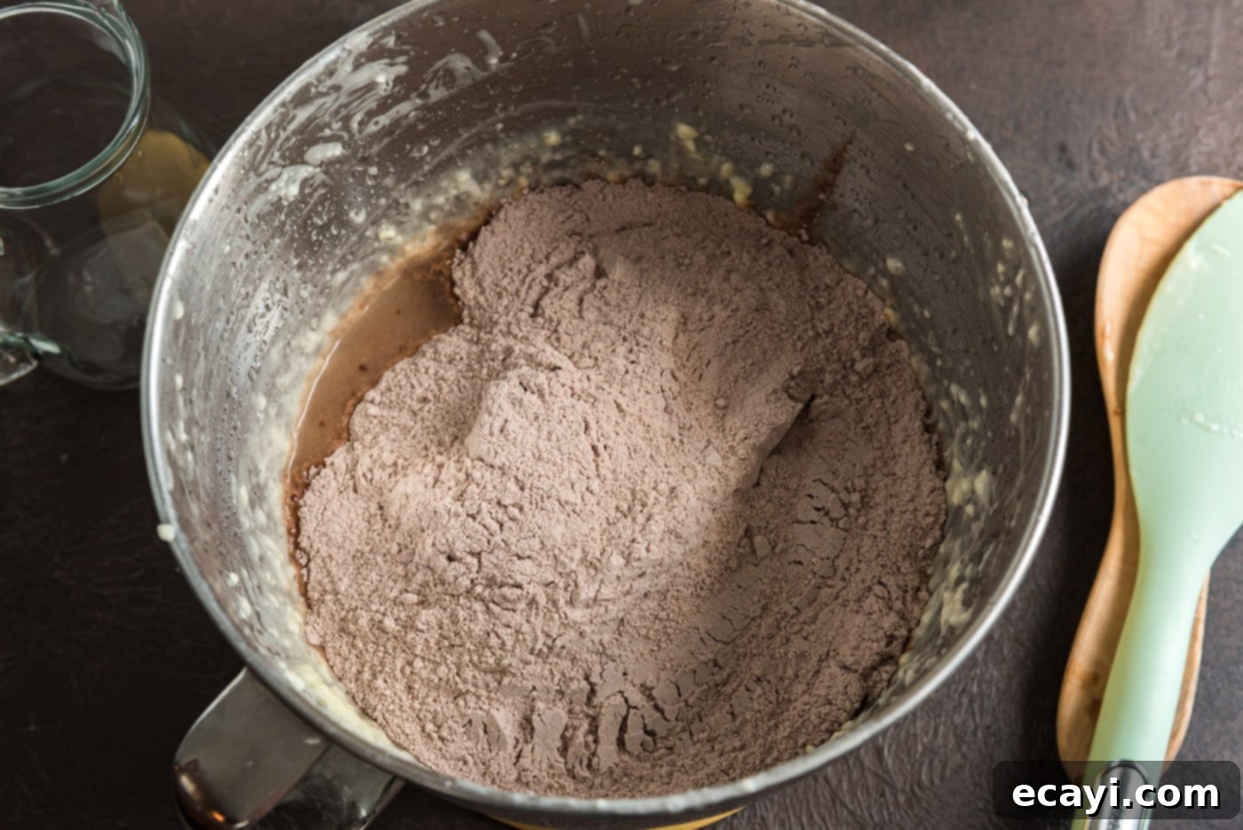 Decadent Chocolate Fudge Delight 12 adding dry ingredients to butter mixture in a mixer bowl