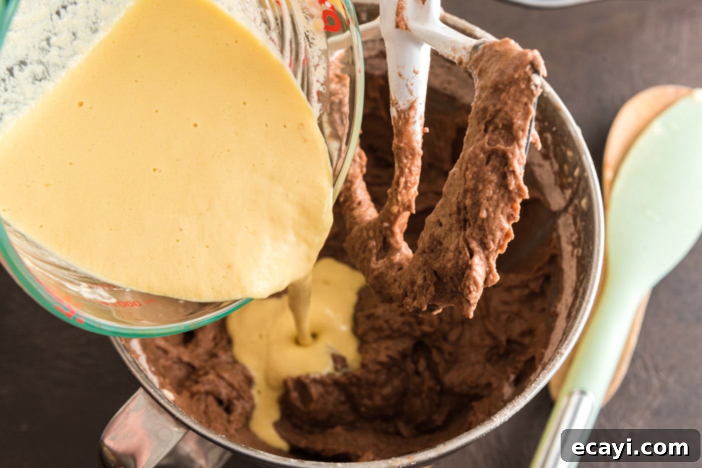 Decadent Chocolate Fudge Delight 14 pouring wet ingredients into chocolate mixture