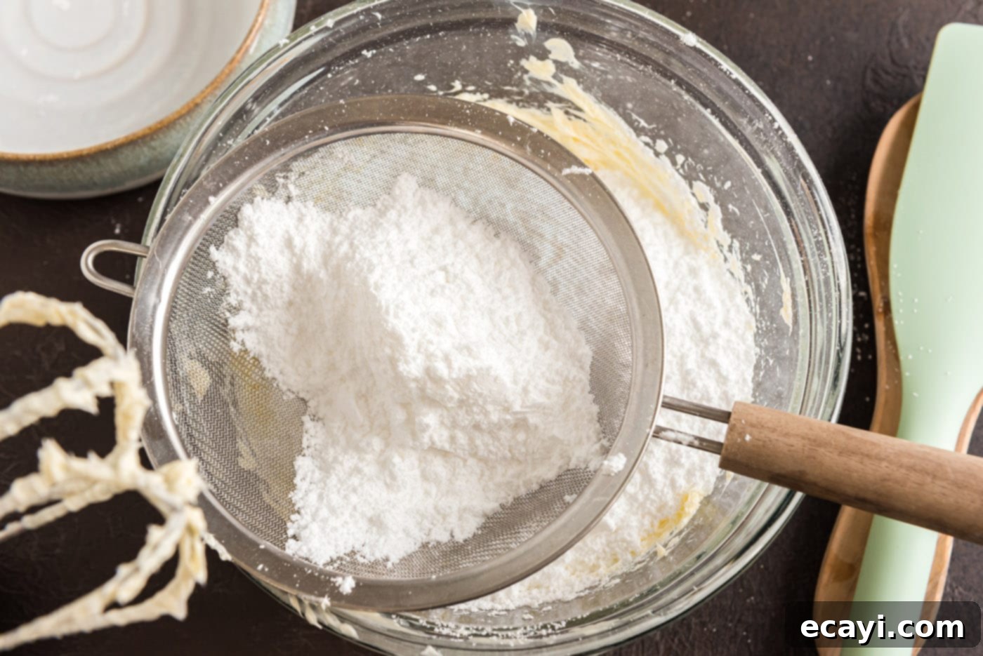 Decadent Chocolate Fudge Delight 20 adding sifted powdered sugar to butter mixture