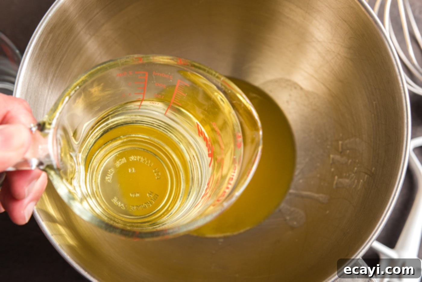 Decadent Chocolate Fudge Delight 10 adding canola oil to melted butter in a bowl