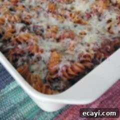 Hearty Italian Sausage Rotini Bake 2 A close up photo of baked rotini with Italian sausage in a baking dish.
