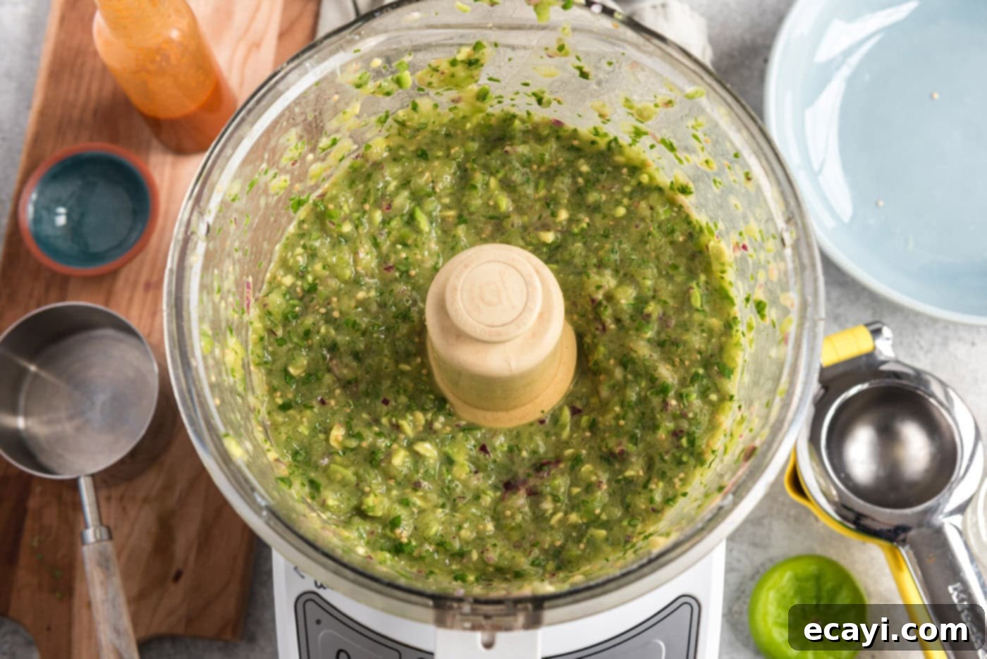 Vibrant Tomatillo Avocado Onion Salsa 8 blitzed tomatillo avocado salsa in a food processor, showing the finished creamy texture