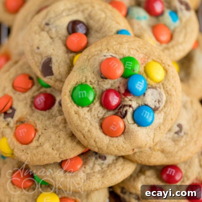 The Ultimate Christmas Cookie Collection: 12 Days 7 Jumbo chocolate chip M&M cookies stacked on a plate