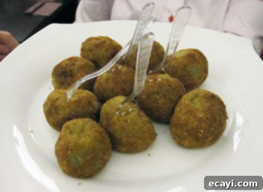 Another kind of arancini, much smaller and filled with spinach. A distinct variety of arancini, notably smaller and generously filled with savory spinach