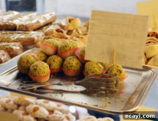 Sicily makes lots of pistachio-based cookies, such as these pistachio balls. Sicily is renowned for its diverse range of pistachio-based cookies, exemplified by these delicious pistachio balls