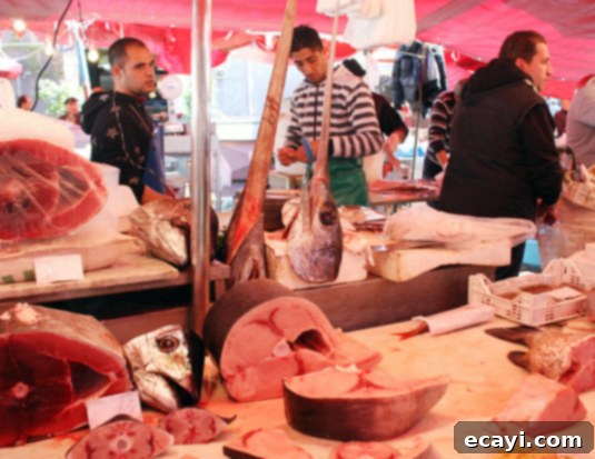Fishermen expose fish heads to prove their product's top quality and freshness (tuna and swordfish, in this case) at La Pescheria, fish market in Catania, Italy Fishermen at La Pescheria in Catania, Italy, proudly expose fish heads, notably tuna and swordfish, as proof of their product's superior quality and unparalleled freshness