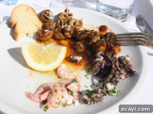 A light lunch: Sea snails, octopus and fresher than fresh shrimp. With lots of lemon, of course. A refreshing light lunch of sea snails, tender octopus, and fresh shrimp, generously dressed with lemon
