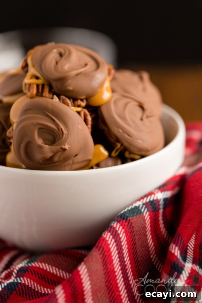 Homemade chocolate turtles are crunchy and chewy, salty and sweet, ideal for edible gifting. Made with toasted pecans, soft, chewy caramel, and rich chocolate. A bowl brimming with delicious homemade chocolate turtles