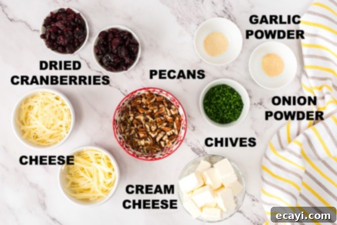 Key Ingredients for a Delicious Cranberry Cheese Ball Various ingredients laid out on a table, including cream cheese, shredded cheeses, pecans, and dried cranberries.