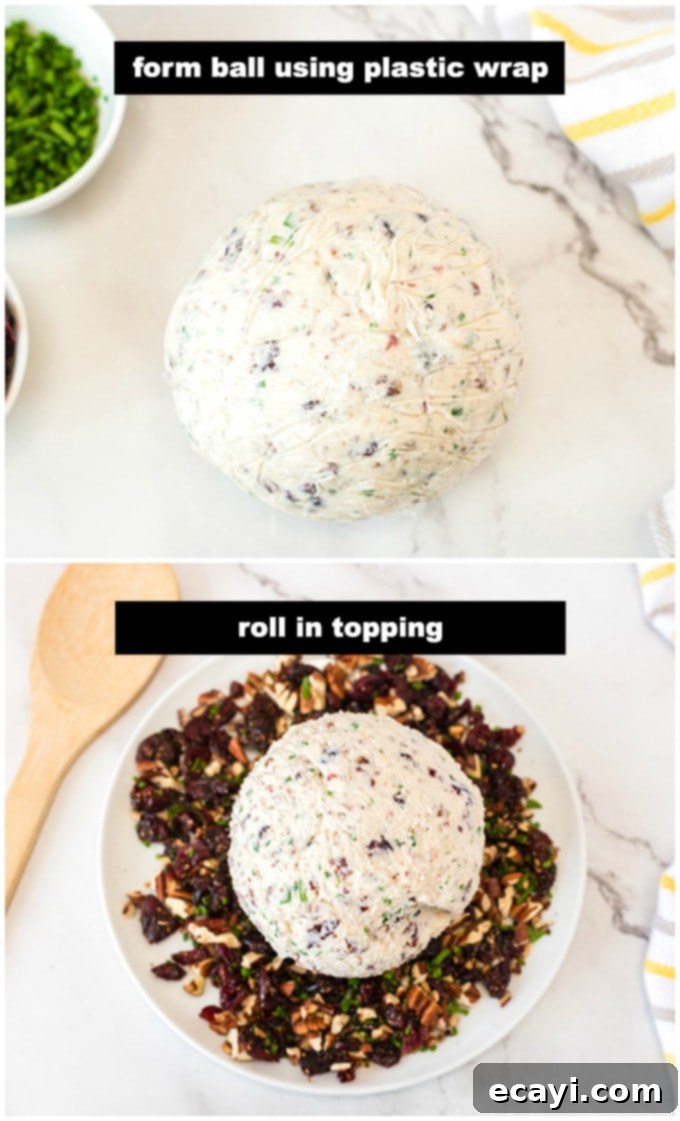 Shaping the Cranberry Cheese Ball with Plastic Wrap The cheese mixture being rolled and shaped into a ball using plastic wrap.