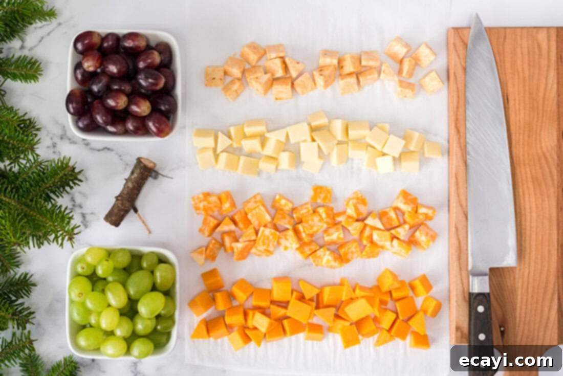 Festive Cheese Tree Board 4 Ingredients for Christmas Tree Cheese Platter including various cheeses and grapes