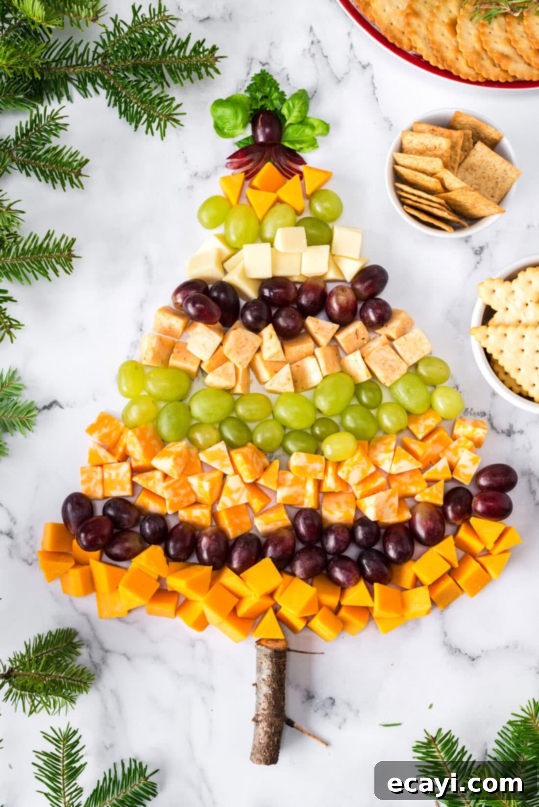 Festive Cheese Tree Board 6 Overhead photo of a fully garnished Christmas Tree Cheese Platter ready for serving