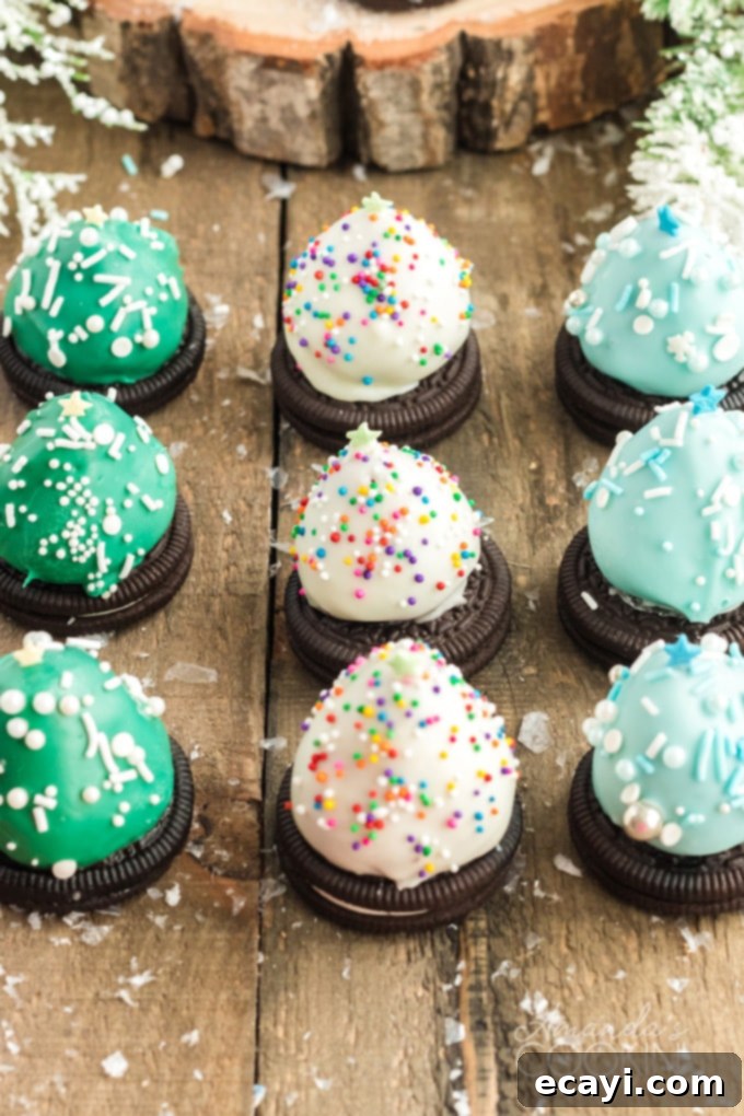 Chocolate covered Strawberry Christmas Trees have an Oreo cookie base, perfect finger food. Delicious strawberries look like festive little Christmas trees! 3 colors of strawberry christmas tree treats