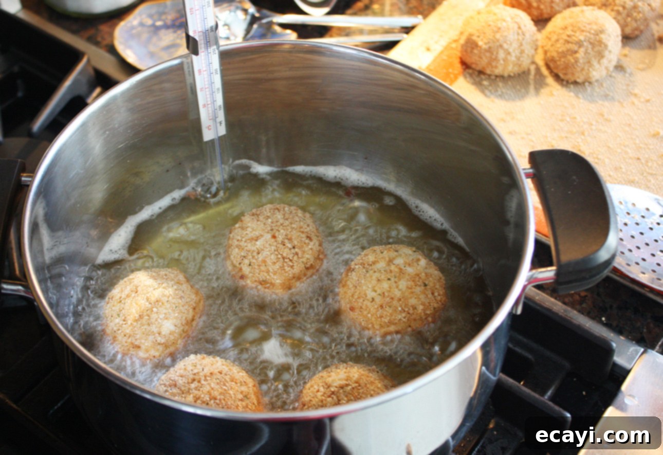 Mastering Authentic Sicilian Arancini 10 Frying arancini (Sicilian risotto balls) without a deep fryer // FoodNouveau.com
