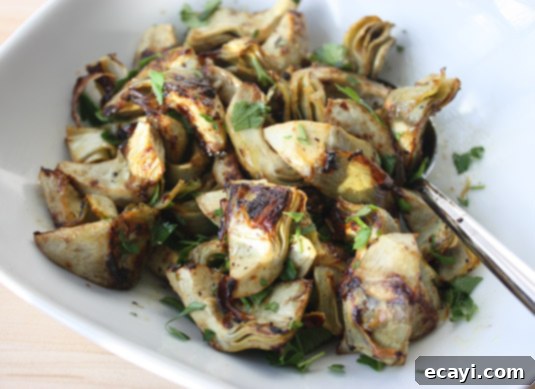 Sautéed Artichoke Preparation Step Sautéing fresh artichoke slices with garlic until tender and golden brown