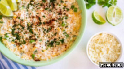 Fiesta Corn Dip 13 Corn dip garnished with fresh green onions and optional cilantro and Cotija cheese for a Mexican flair