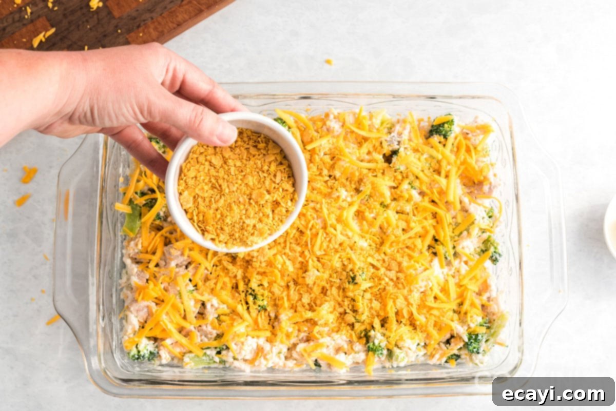 Creamy Chicken and Broccoli Rice Casserole 5 adding crushed corn flakes and melted butter to Make Chicken Broccoli Rice Casserole