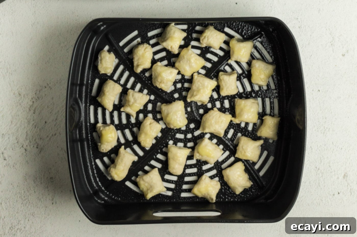 Perfectly Poppable Air Fried Pretzels 12 Pretzel dough bites in an air fryer basket