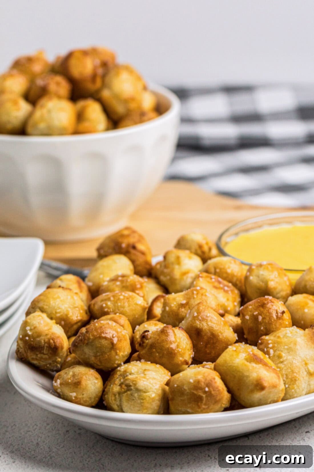 Perfectly Poppable Air Fried Pretzels 13 Plate of Air Fryer Pretzel Bites with more in a bowl in the background